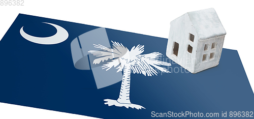 Image of Small house on a flag - South Carolina