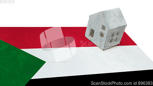 Image of Small house on a flag - Sudan