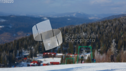 Image of Blur panoramic view of sport resort for winter vacation. Skies with back light. Warm filter with original sun color tones