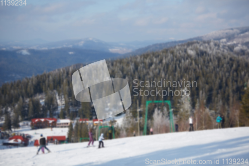 Image of Blur panoramic view of sport resort for winter vacation. Skies with back light. Warm filter with original sun color tones