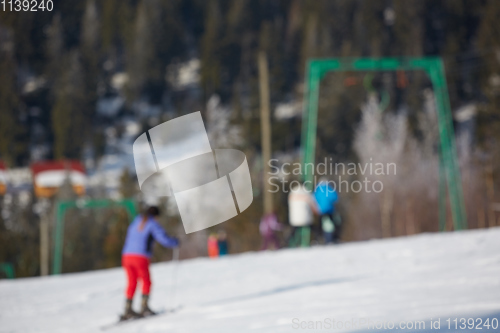 Image of Blur panoramic view of sport resort for winter vacation. Skies with back light. Warm filter with original sun color tones