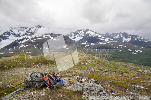 Image of Backpacker\'s bag on top of mountain