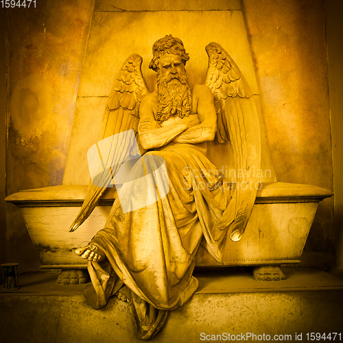 Image of Angel statue on a 1820 tomb located in an old Italian cemetery