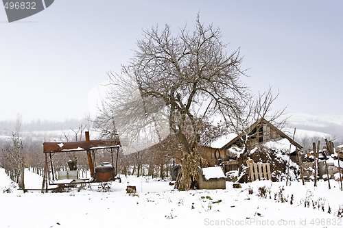 Image of traditional alcohol still in farmyard