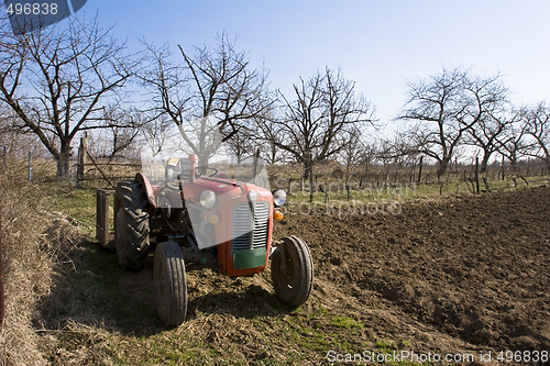 Image of old tractor in a field