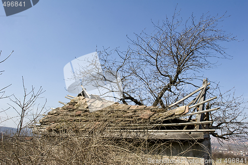 Image of traditional mud house in field