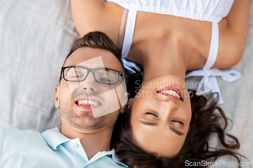 Image of happy couple on picnic blanket