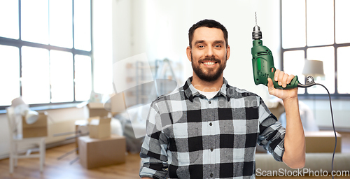 Image of happy man, worker or builder with drill at home