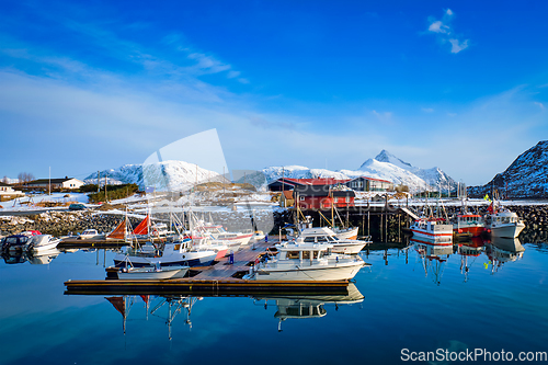 Image of Fishing boats and yachts on pier in Norway