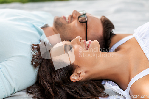 Image of happy couple on picnic blanket