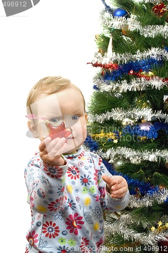 Image of Baby and christmas tree