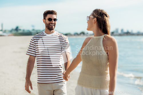 Image of happy couple on summer beach