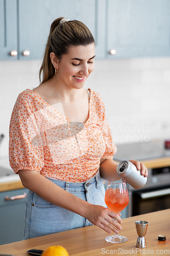 Image of woman making cocktail drinks at home kitchen