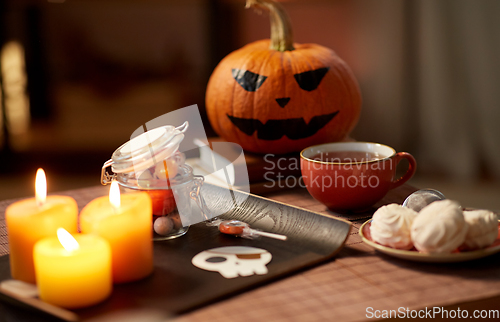 Image of halloween party treats and decorations on table