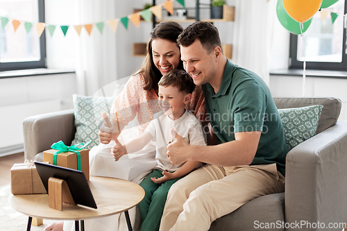 Image of family with tablet pc has video call on birthday