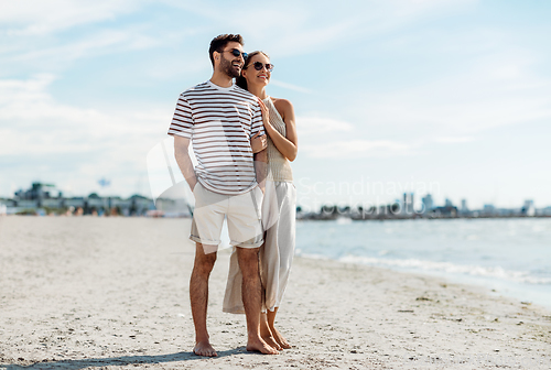 Image of happy couple on summer beach