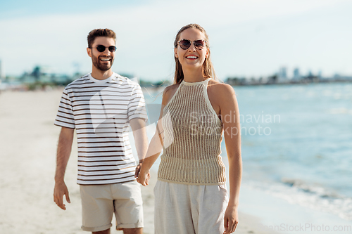 Image of happy couple on summer beach