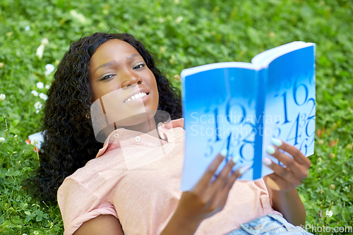 Image of african student girl reading math textbook