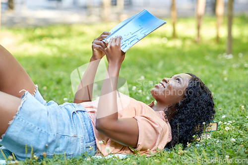 Image of african student girl reading math textbook