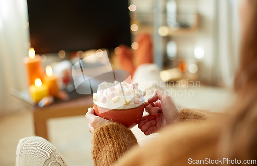 Image of woman with cream and marshmallow on halloween