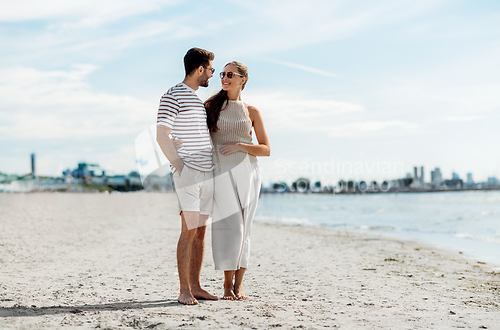 Image of happy couple on summer beach