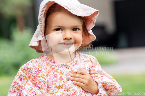 Image of happy little baby girl outdoors in summer