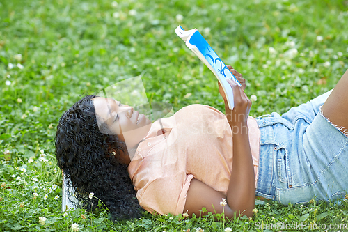 Image of african student girl reading math textbook