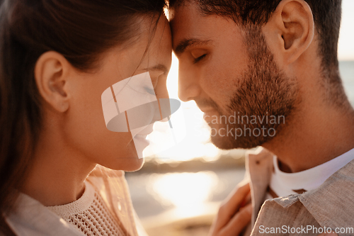 Image of happy couple with closed eyes on summer beach