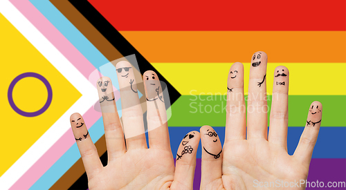 Image of close up of hands and fingers with gay wedding