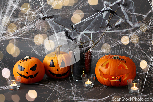 Image of pumpkins, candles and halloween decorations