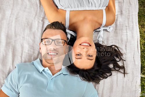 Image of happy couple on picnic blanket