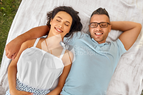 Image of happy couple on picnic blanket