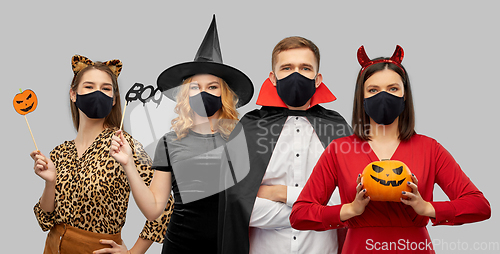 Image of friends in halloween costumes and black masks