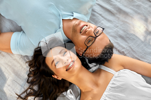 Image of happy couple on picnic blanket