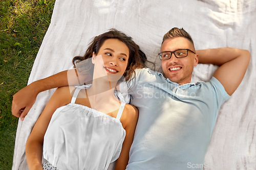 Image of happy couple on picnic blanket