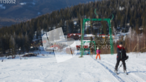 Image of Blur panoramic view of sport resort for winter vacation. Skies with back light. Warm filter with original sun color tones