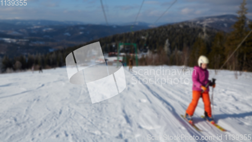 Image of Blur panoramic view of sport resort for winter vacation. Skies with back light. Warm filter with original sun color tones