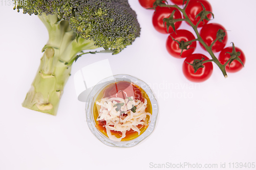 Image of Vegetarian broccoli green soup puree with tomato