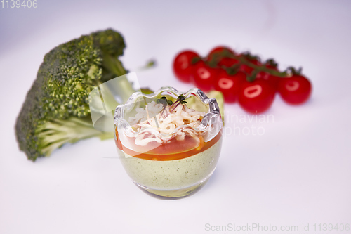 Image of Vegetarian broccoli green soup puree with tomato