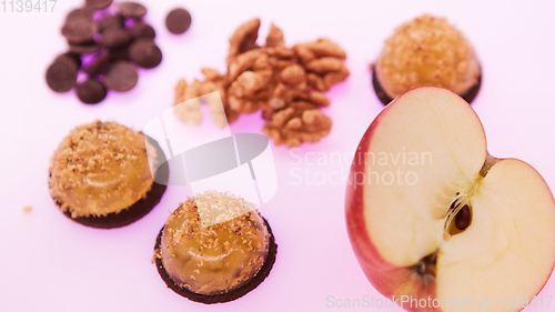 Image of Fruit jelly with fresh apple. Healthy food. Apple jelly on chocolate with walnuts. Summer dessert with fruit jelly