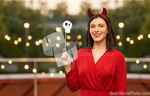 Image of happy woman in red halloween costume of devil