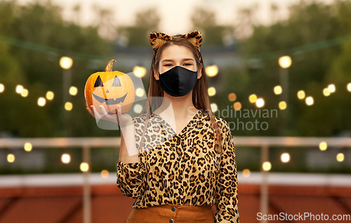 Image of woman in black mask and halloween costume