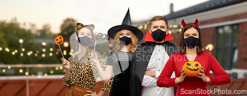 Image of friends in halloween costumes and black masks