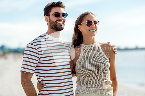 Image of happy couple on summer beach