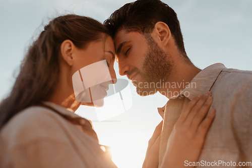 Image of happy couple with closed eyes outdoors