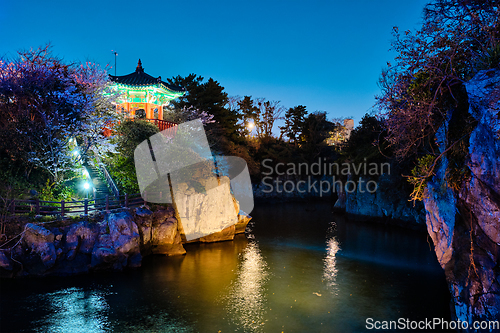 Image of Yongyeon Pond with Yongyeon Pavilion illuminated at night, Jeju islands, South Korea