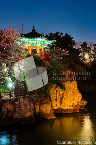 Image of Yongyeon Pond with Yongyeon Pavilion illuminated at night, Jeju islands, South Korea