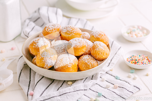 Image of Cottage cheese donuts balls with sugar in a bowl. Healthy curd d