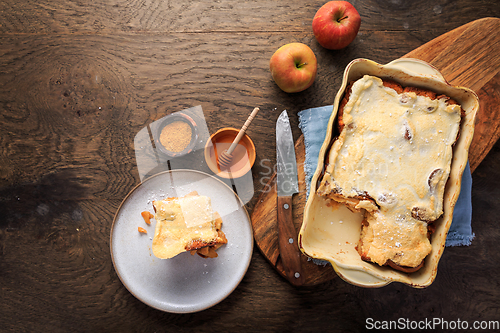 Image of Homemade bread pudding breakfast casserole with apples and cinnamon