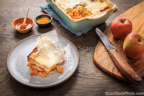 Image of Homemade bread pudding breakfast casserole with apples and cinnamon